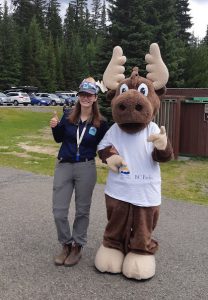 Student ranger posing besides Jerry the Moose mascot at E.C. Manning Provincial Park